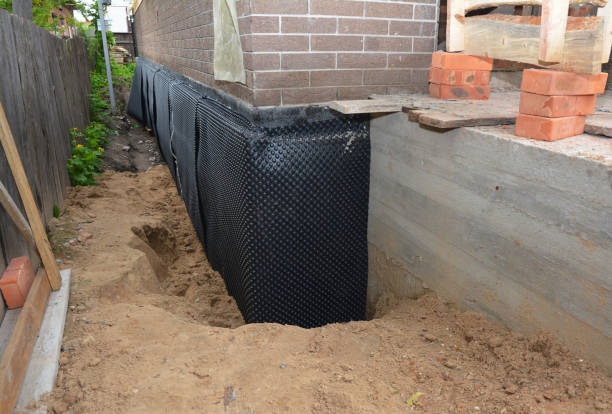 SJ Waterproofing Pros technician performing targeted Sump Pump Installation assessment in Wheeling, IL